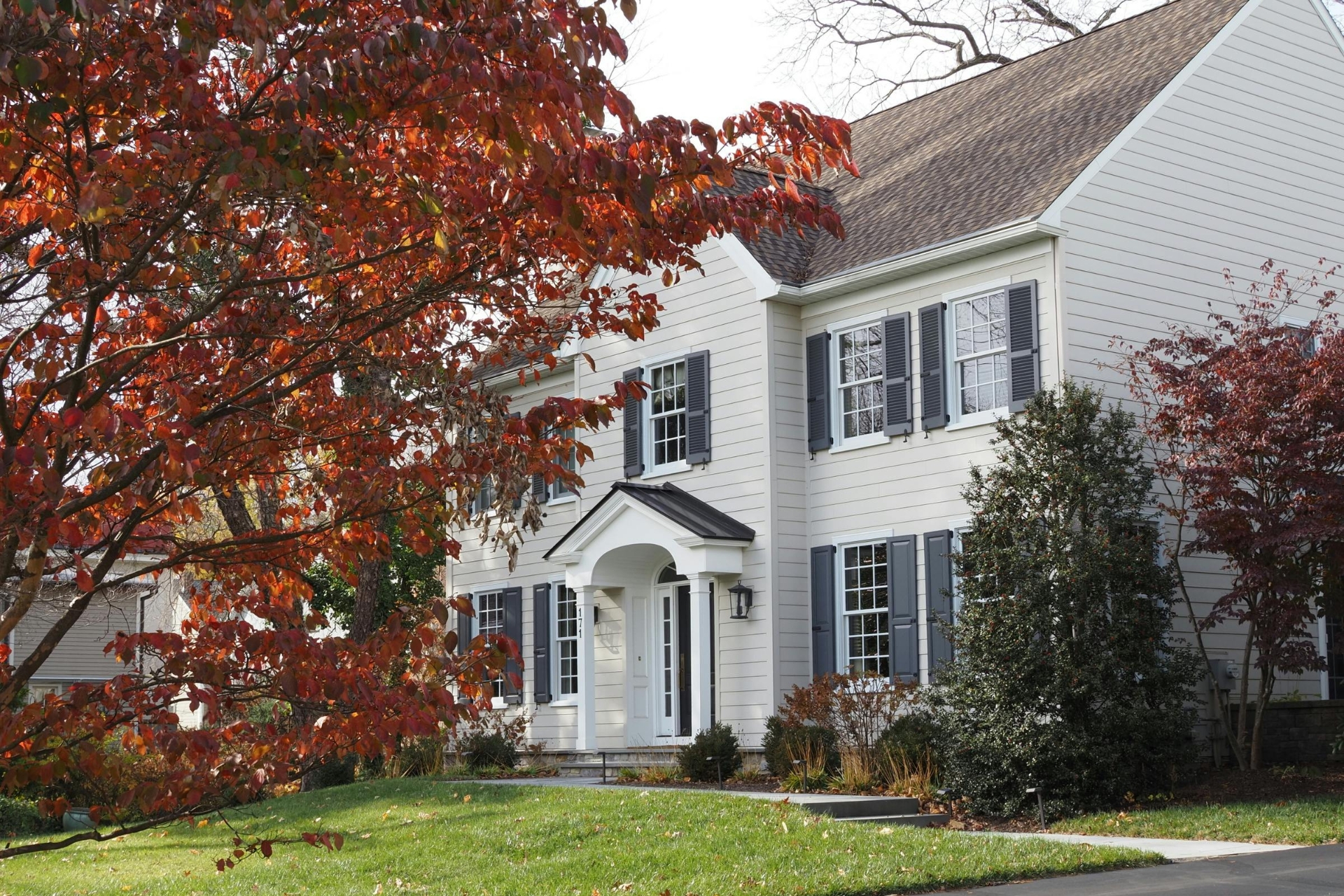 Home in a residential homeowners association community with landscaped property and maintained exterior