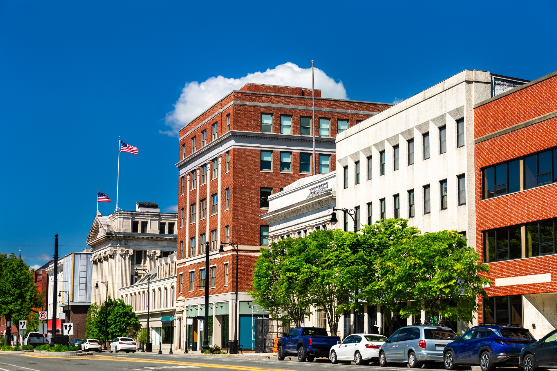 mixed use commercial buildings with retail storefronts and offices along a downtown street